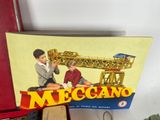 a box with a picture of a man and a boy playing with a crane