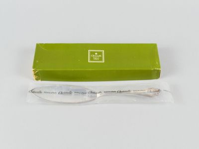a green box with a spoon in it and a green box with a spoon in it
