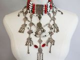 a close up of a mannequin with a necklace on it