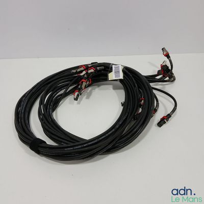 a close up of a pair of black wires on a white surface
