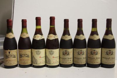 six bottles of wine are lined up in a row on a table