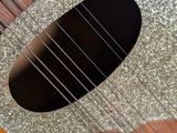 a close up of a guitar with a hole in it