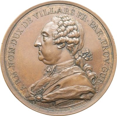 une image représentant une médaille de bronze à l'effigie d'un homme aux cheveux longs