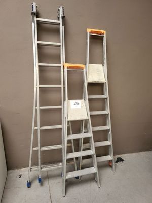 two ladders that are standing next to each other