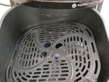 a close up of a fryer that is on a counter