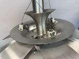 an image of a machine that is working on a piece of metal