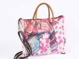 a close up of a purse on a white background with pink flowers