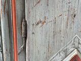 a picture of an old door with a picture on it
