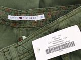 the back of a pair of green pants with a label on it