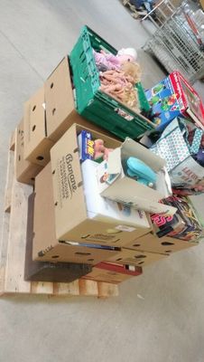 a pile of boxes sitting on top of a pallet in a store