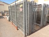 a large metal fence that is in the middle of a lot
