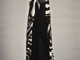black and white photograph of a woman in a long dress