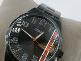 a watch that is sitting on top of a pillow