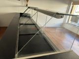 an image of a glass display case in a room