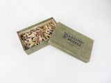a box of nuts sitting on top of a white table