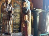 two statues that are sitting on top of a table