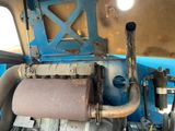a close up of a machine with a roll of paper on it