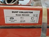 a close up of a dust collector label on a machine