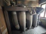 a room that has a bunch of pipes in it