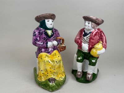 Deux pichets dt"Jacquot" en faïence polychrome figurant un c…