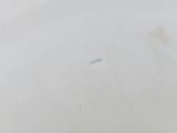 a close up of a white bowl with a brown substance in it