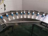 a picture of a conveyor belt with a lot of bottles on it