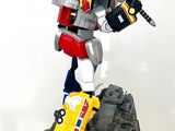 a statue of a robot with a sword on top of a table