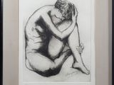framed black and white drawing of a nude woman sitting on her knees