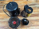 a blender and a coffee maker on a wooden table