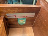 a close up of a wooden box with a label on it