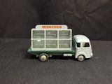 a toy truck that is sitting on a black surface