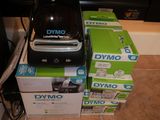 boxes of dymo products stacked on top of each other in front of a fireplace