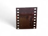 a film strip with a picture of a man riding a horse