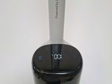a black and silver blender with a clock on top of it