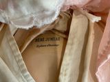 a picture of a close up of a pink and white dress