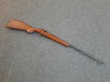 a rifle that is laying on the floor