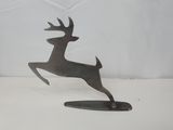 sculpture of a leaping deer on a surfboard on a white surface