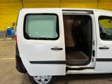 a white van with its doors open in a parking lot