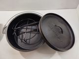 a pot with a handle and a lid sitting on a counter