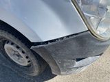 a car that has a dent in the front of it