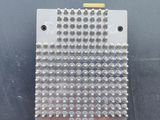 a close up of a metal plate with rivets on it