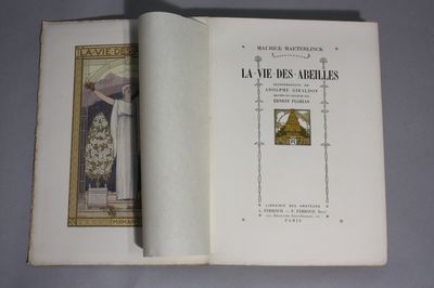 an open book with a picture of a man in a priest ' s robes