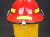 fireman ' s helmet with yellow and red tape around the brim
