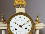 a clock that is sitting on top of a table