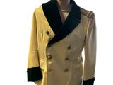 a mannequin with a white jacket and black collar