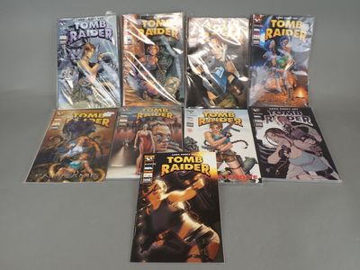 the comic books are lined up on a table