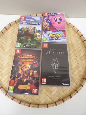 three video games sitting on a tray on a table