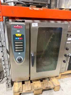 two ovens that are sitting on a pallet in a warehouse