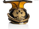 a black and gold helmet with a gold eagle on it