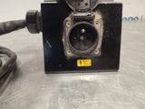 an image of a black electrical outlet with a cord